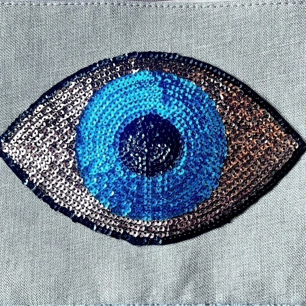 NWT sequin eye zippered pouch with wristlet strap